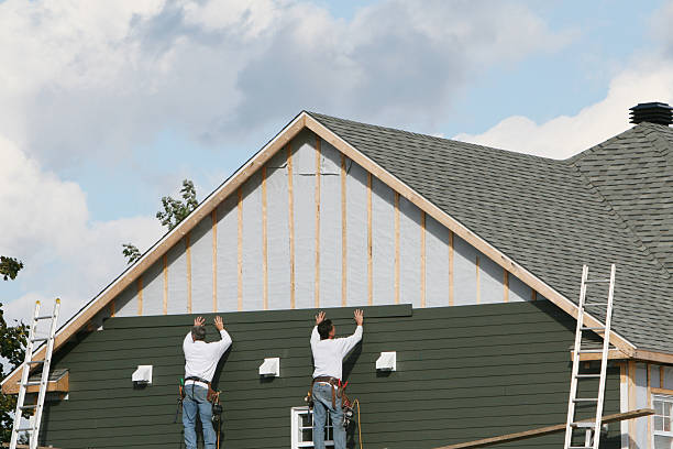 Professional Vinyl Siding technician working in Weems, VA